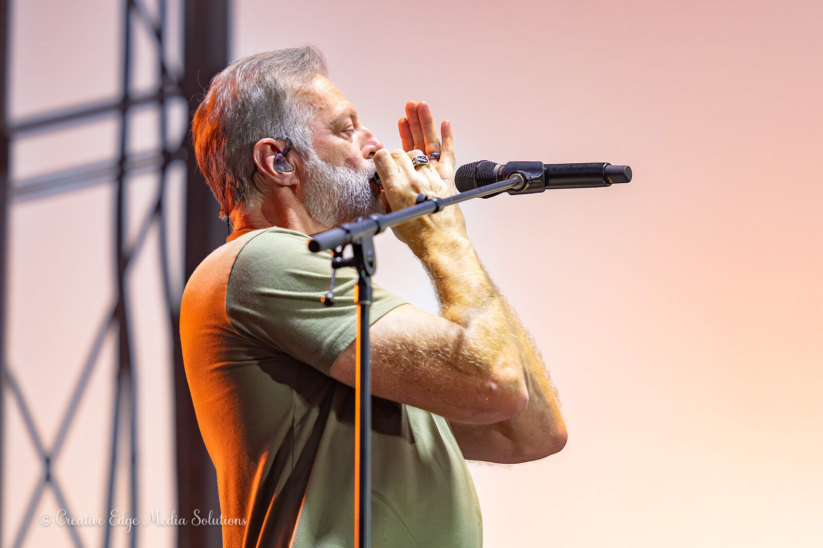 Singer performing, warm stage light