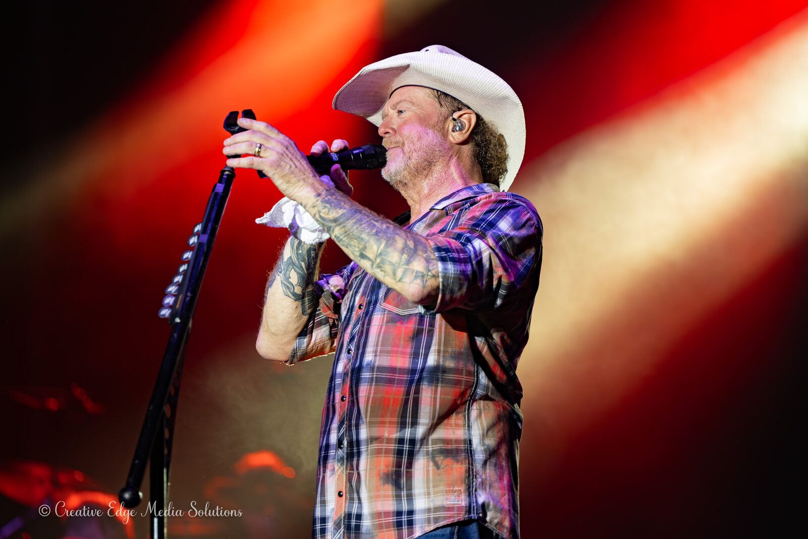 Country singer, dramatic stage lighting