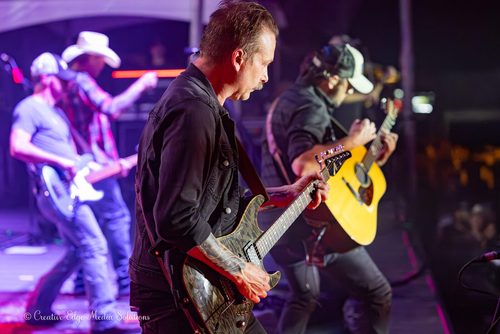 Guitarists performing together