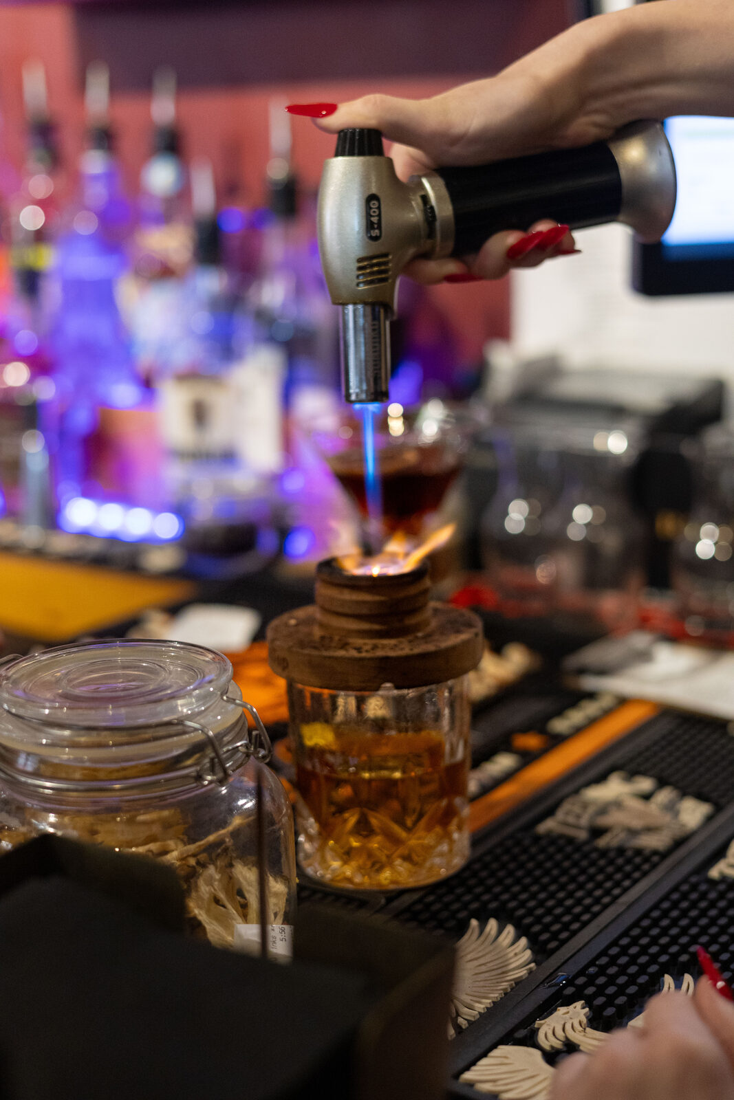 Bartender flaming cocktail
