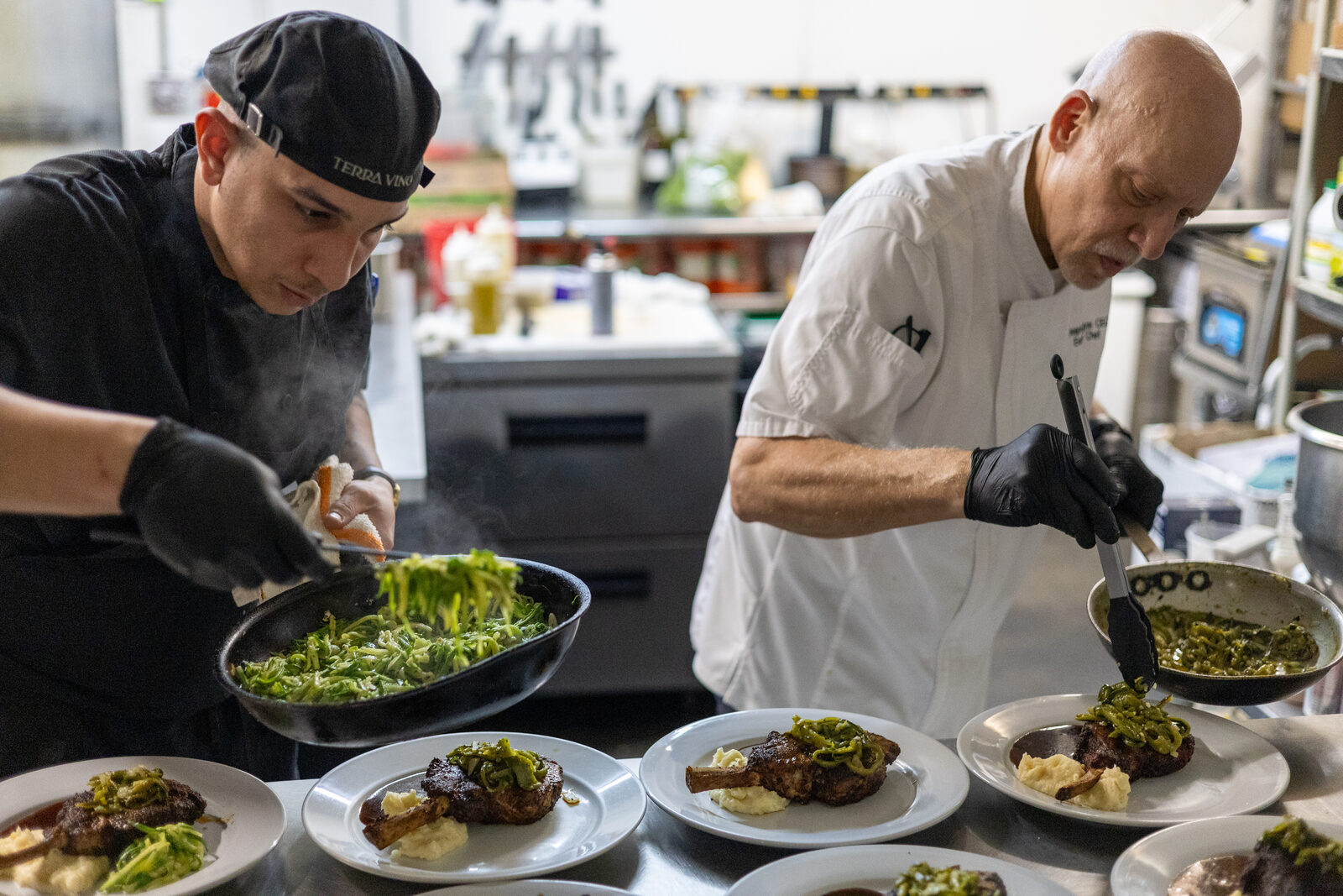 Chefs sautéing vegetables